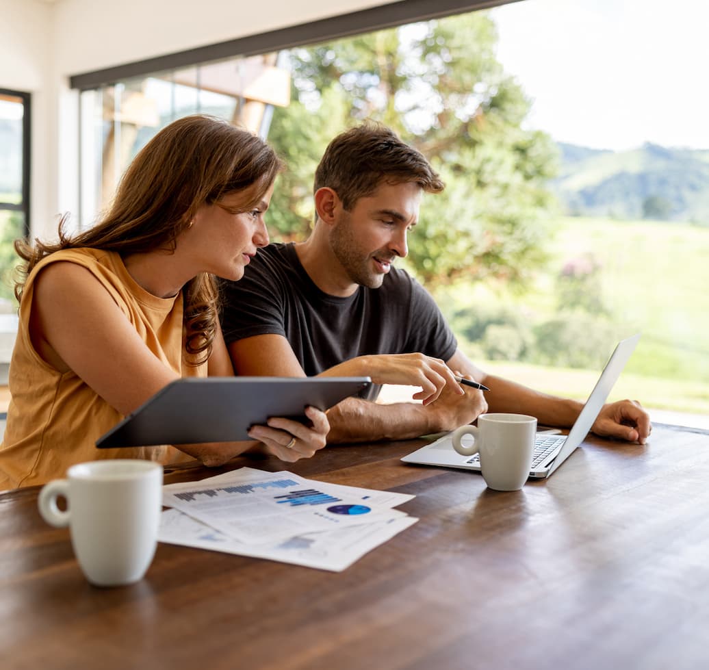 Brazilian business partners working at home while using technology - lifestyle concepts