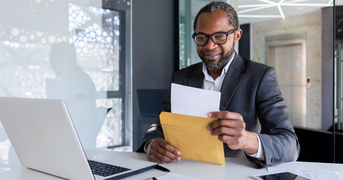 Business owner reviewing financial documents at desk