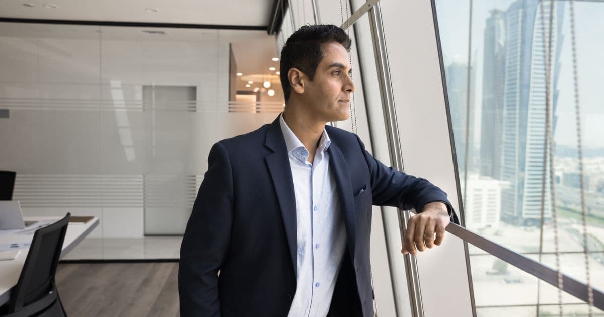 Business executive planning private market investment strategy